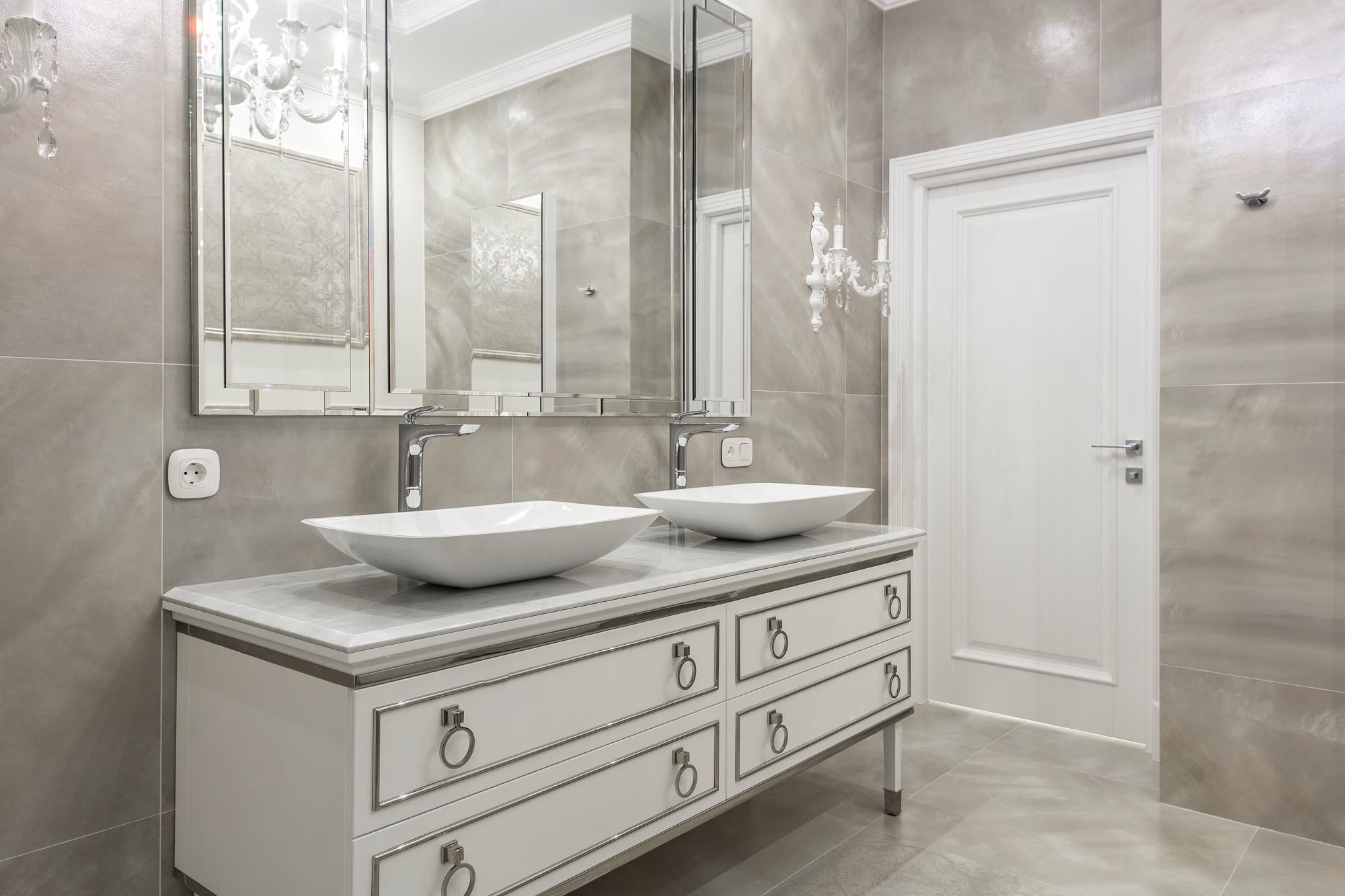 Luxurious bathroom vanity with granite countertop, elegant stone surface with natural veining, professional renovation with modern fixtures